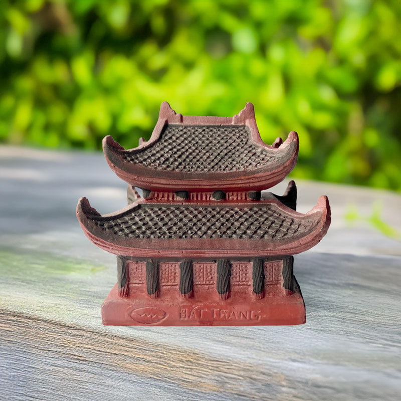 Back of the ceramic Vietnamese pagoda showing "BAT TRANG" stamp. A miniature pagoda statue.