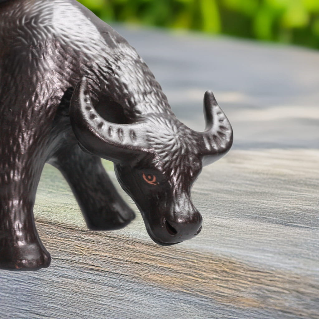 Detailed face of a black cute water buffalo. This buffalo figurine shows fine texture