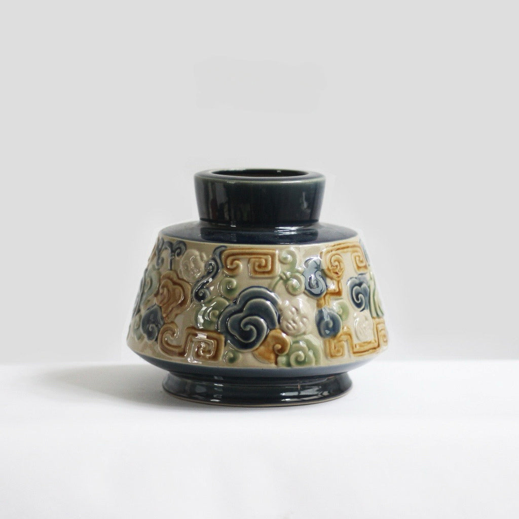 A blue Vietnamese ceramic vase with a unique cloud motif. This stunning ash glaze vase.