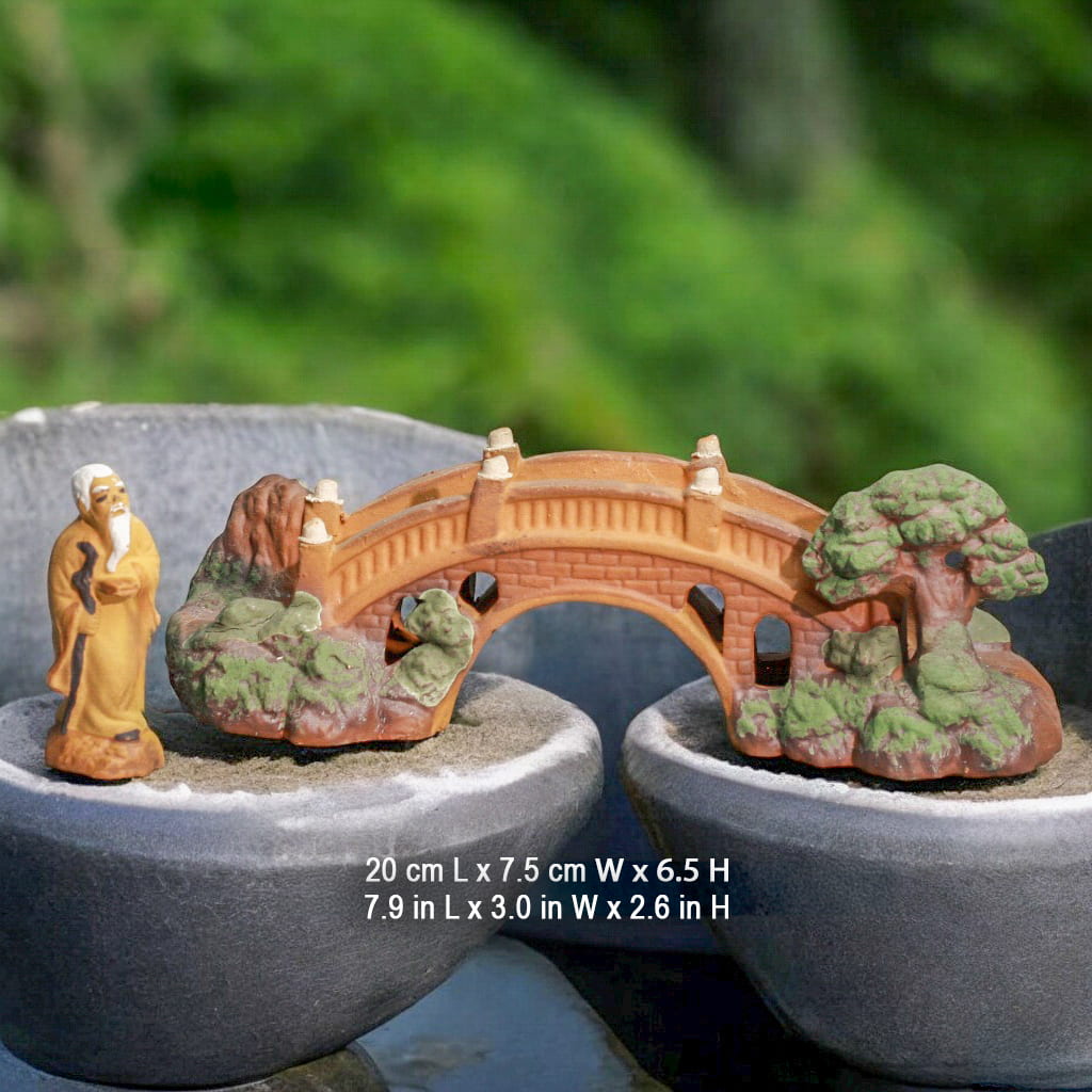 Bonsai Bridge, a miniature bridge for garden, spans two pots with a mudman