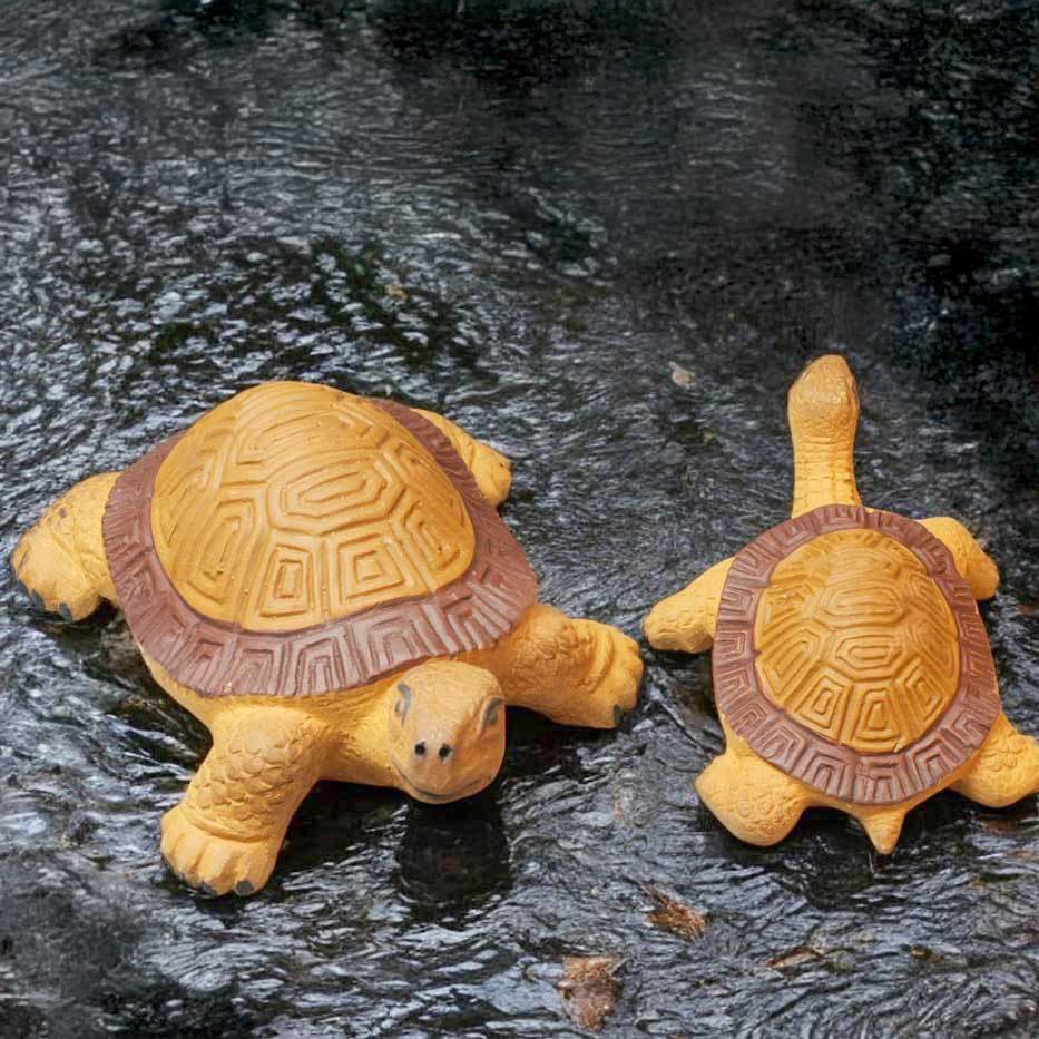 Two ceramic turtles for outside, one large outdoor turtle statue, one smaller turtle figurine.