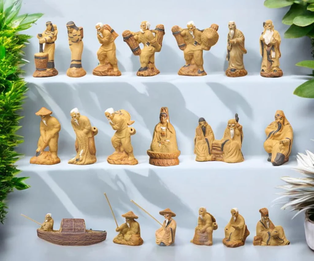 Shelves show a collection of bonsai mudmen figurines. These Chinese mudmen are unique bonsai decor.