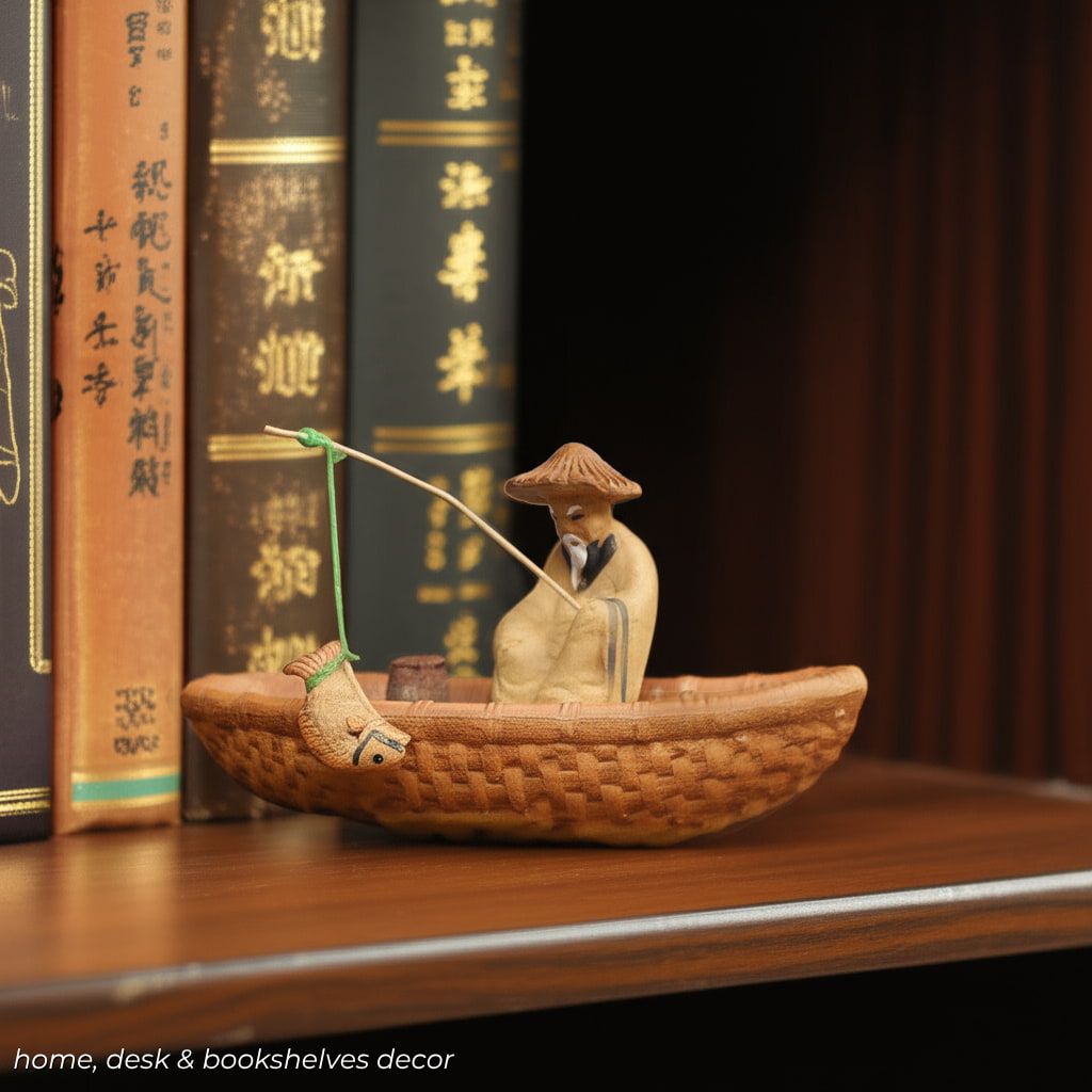 A miniature fisherman figurine sits on a bookshelf. This is a classic Chinese fisherman figurines style.