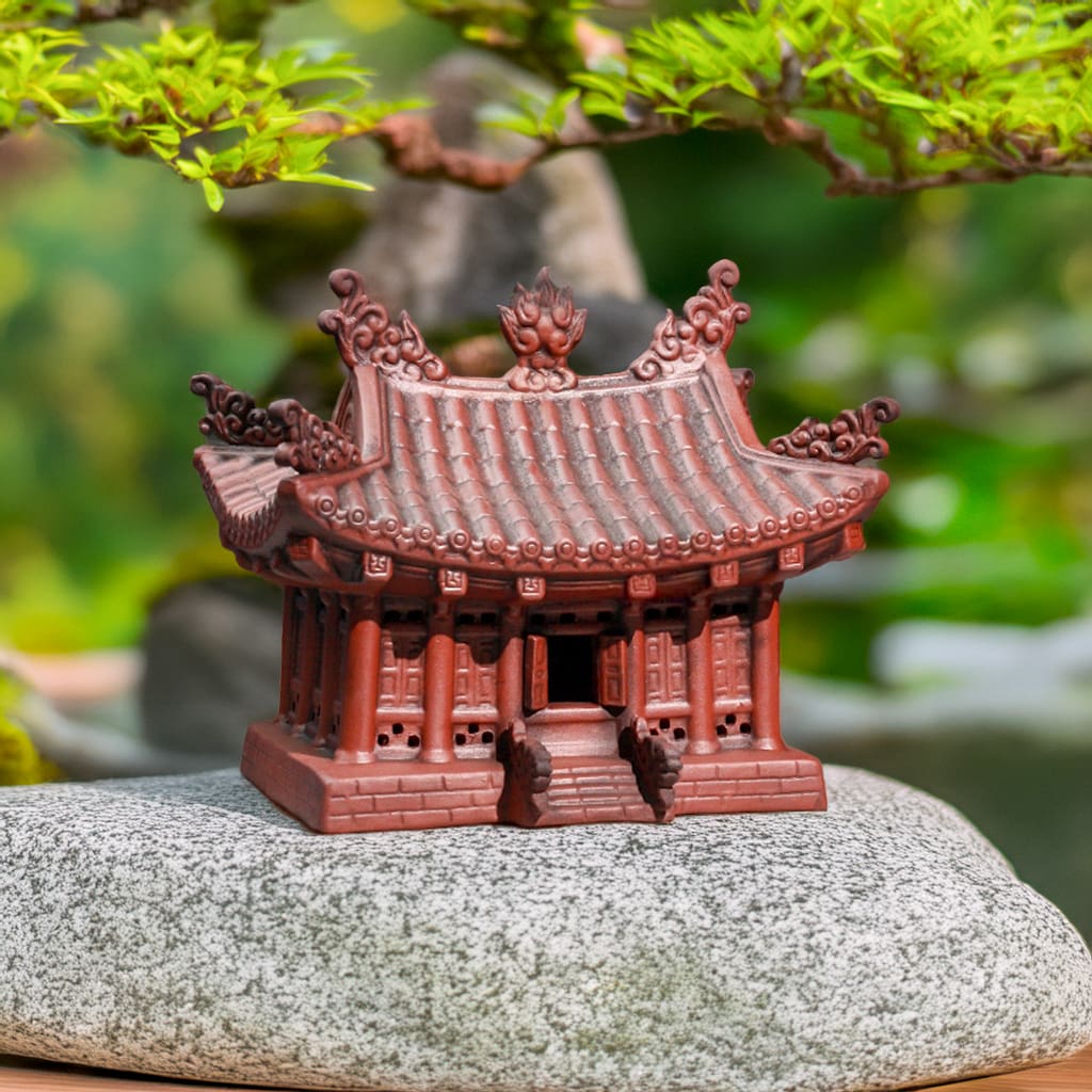 Reddish-brown handcrafted asian pagoda statue, a ceramic pagoda for garden