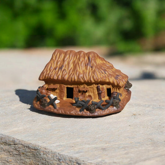 Detailed view of the handcrafted terracotta Miniature Thatched Roof Hut, suitable as terrarium decor or a bonsai figurine.