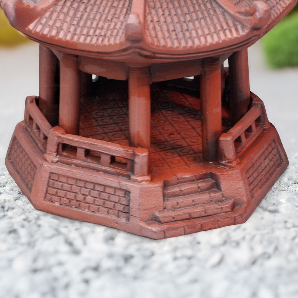 Octagonal base of a reddish-brown pagoda statue. Handcrafted miniature Japanese pagoda for bonsai detail.