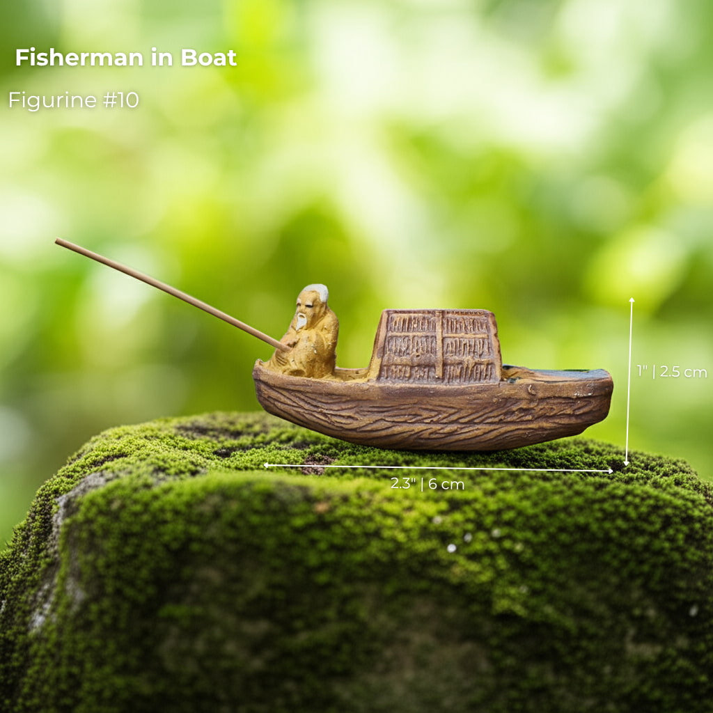 A miniature boat on green moss. A simple mudmen figurine to complete your bonsai scenery.