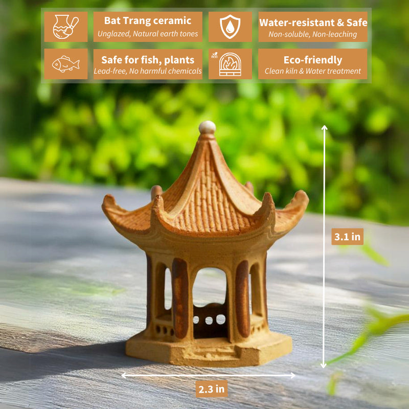 A miniature Vietnamese pagoda, crafted from earthy brown ceramic, stands serenely on a wooden surface, evoking a sense of tranquility and ancient beauty.