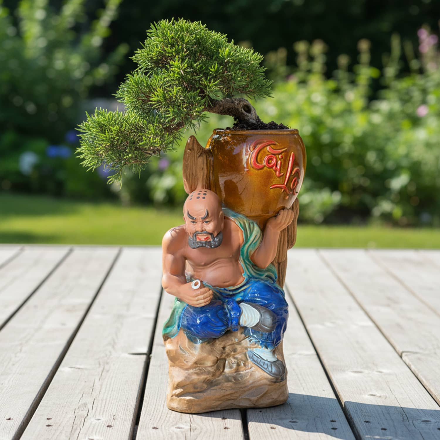 A pine bonsai tree planted in this unique bonsai pot. A detailed and functional mudman bonsai pot.