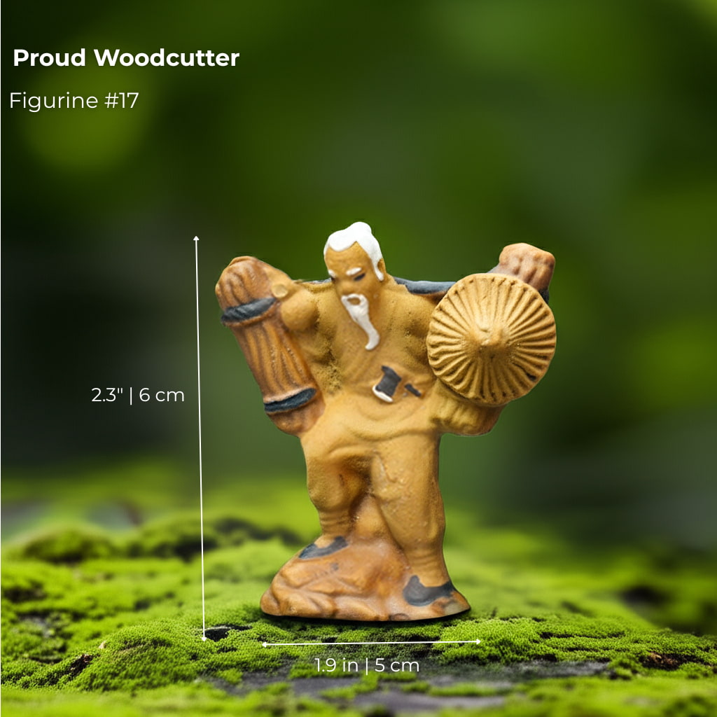 A Proud Woodcutter mudmen figurine holding wood and a hat. A strong piece for your bonsai decor.