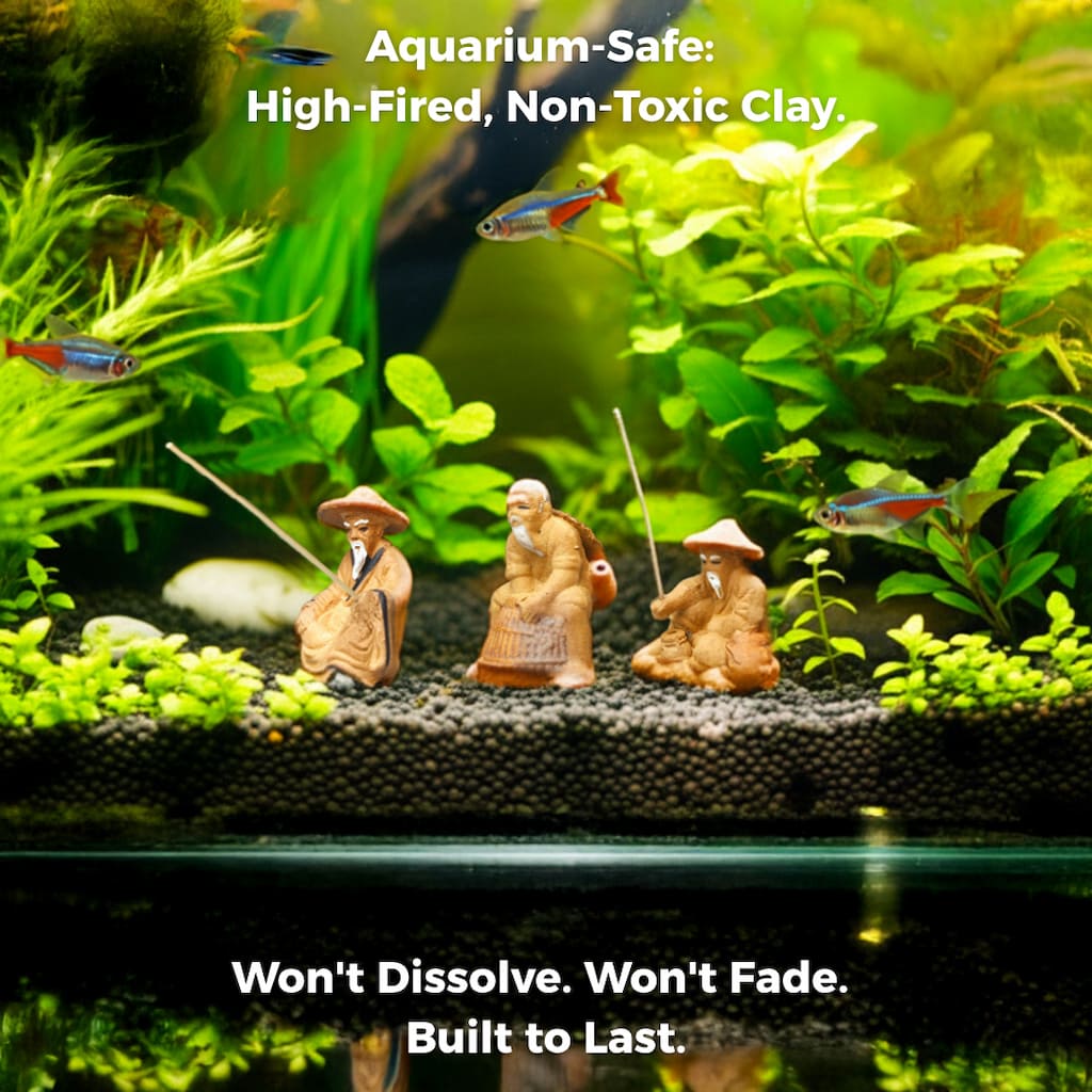Three ceramic fisherman figurines sitting on aquarium gravel in fish tank. Safe ceramic aquarium decor.