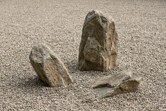 Three compatible garden stones arranged in an uneven triangle.