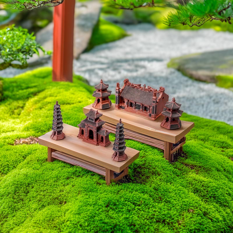 Two stands on moss with miniature pagodas, a ceramic pagoda tower & three entrance gate pagoda.