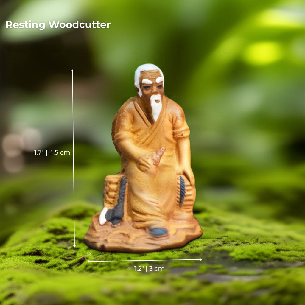 A seated mudmen figurine with white hair. This Bonsai tree figurine brings calm to your decor.