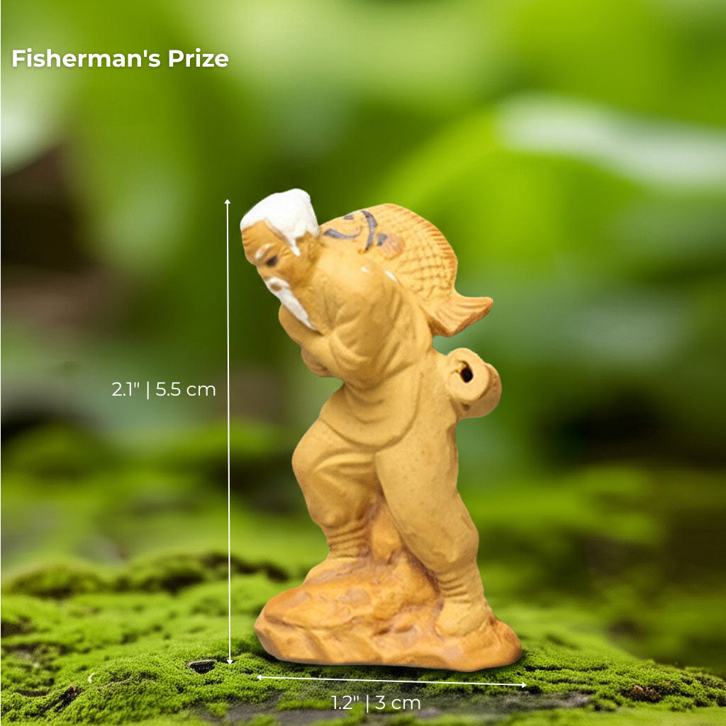  A mudmen figurine of a fisherman with a large fish on his back. A unique bonsai decor piece.