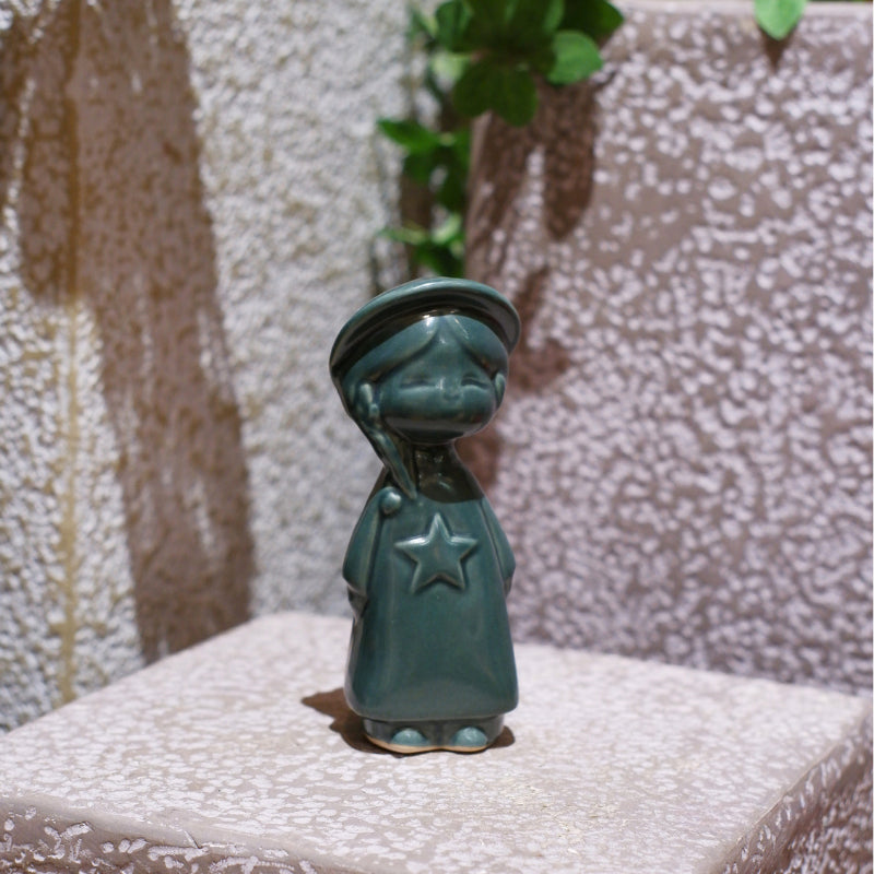 Teal Vietnamese ceramic star child figurine
