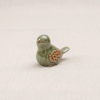 Close-up of a green-glazed Vietnamese ceramic bird figurine