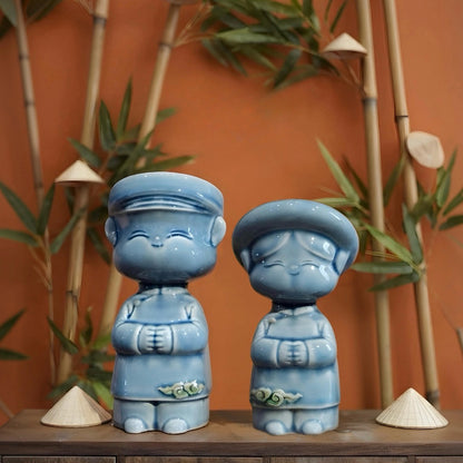 Blue Vietnamese ceramic children couple figurines with bamboo and miniature conical hats