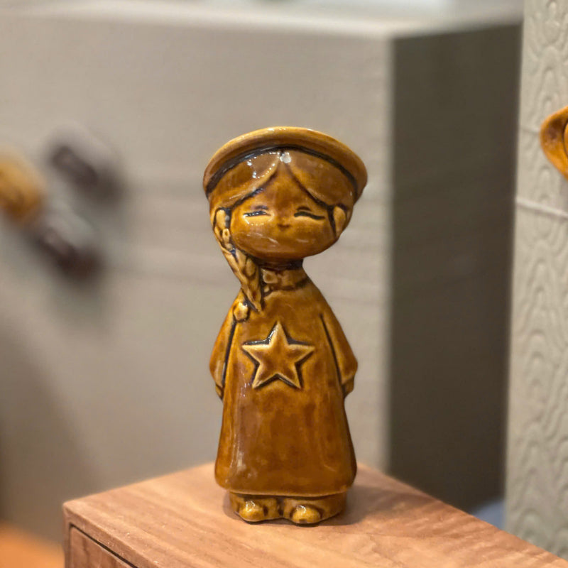 Amber Vietnamese ceramic star child figurine