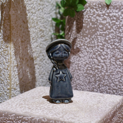Dark blue Vietnamese ceramic star child figurine