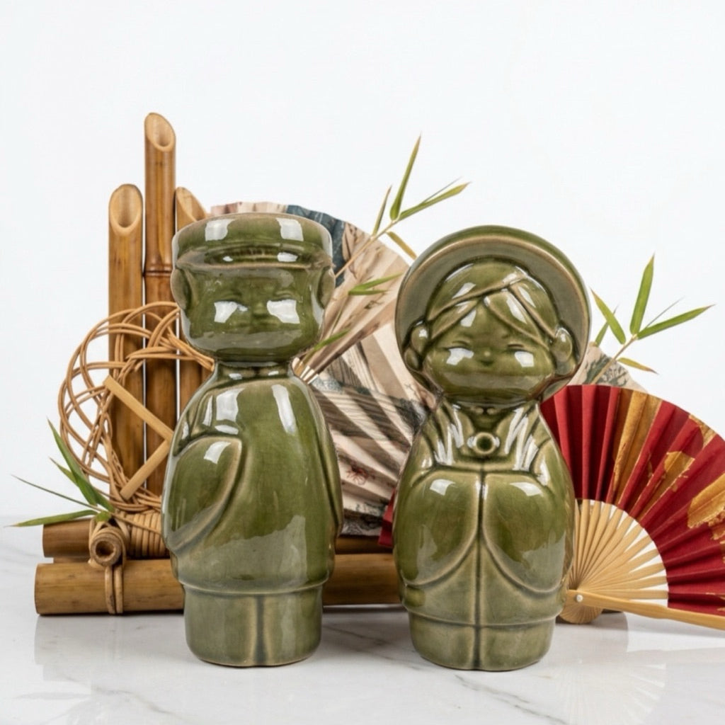 Close-up of Vietnamese ceramic woman figurines in blue, olive and dark green glazes