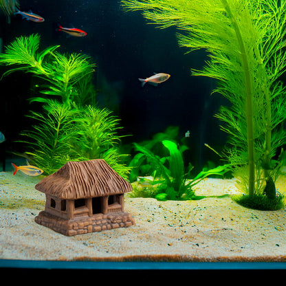  Nestled amongst vibrant aquatic plants and colorful fish, a miniature Vietnamese thatched house adds a touch of cultural charm to this underwater world.