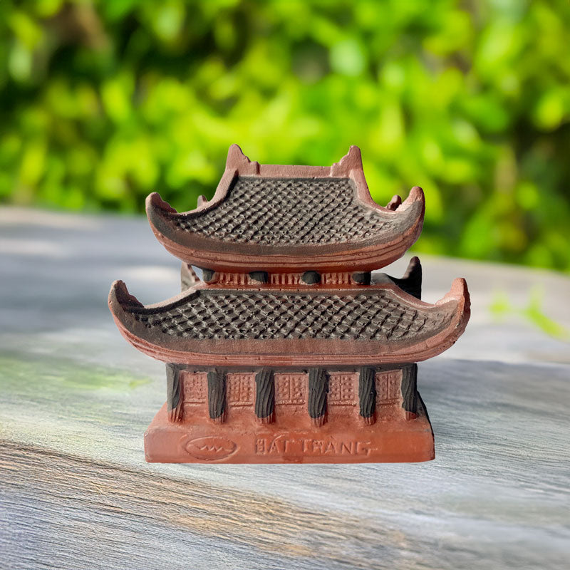 Handcrafted in the heart of Vietnam, this miniature ceramic pagoda, with its intricate details and inscription "Bat Trang," adds a touch of cultural heritage to any miniature landscape.