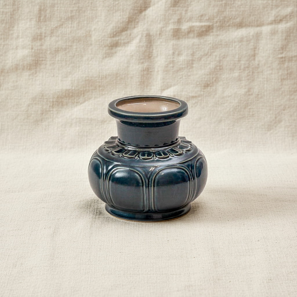 A dark blue artisan ceramic vase. This Vietnamese ceramic vase is a beautiful low, wide shape.