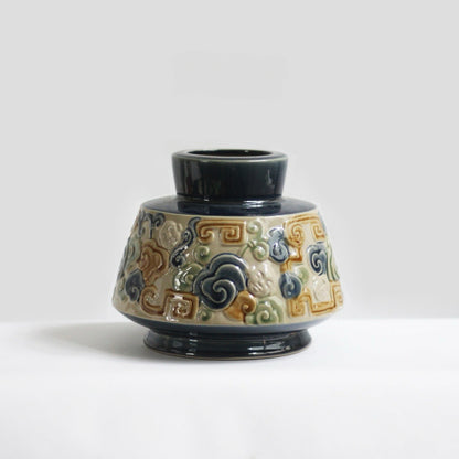 A blue Vietnamese ceramic vase with a unique cloud motif. This stunning ash glaze vase.