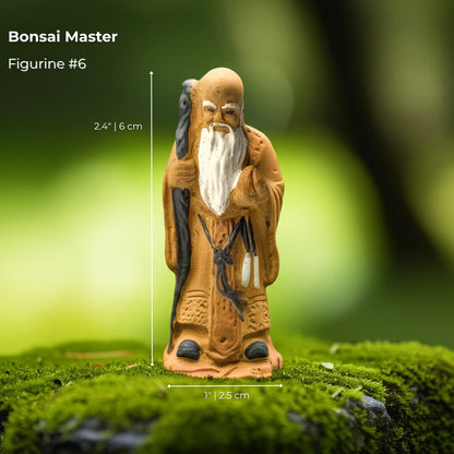 A "Bonsai Master" bonsai mudmen figure on moss. A detailed mudmen figurine for bonsai decor.