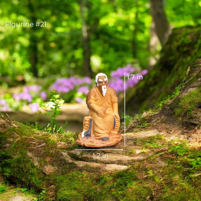 Small clay figurine of a gardener kneeling and watering plants.