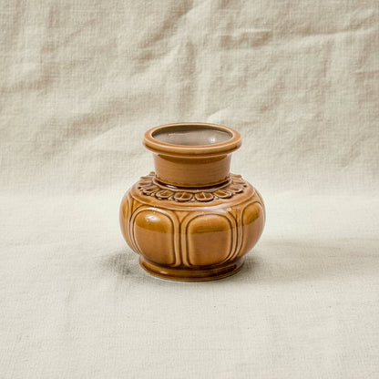  A brown handmade ceramic flower vase with a glossy finish. This low wide flower vase is artisan made. 