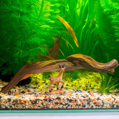 Standing proudly amidst vibrant green plants in a serene aquarium, a miniature ceramic deer brings a touch of the wild to this underwater sanctuary.