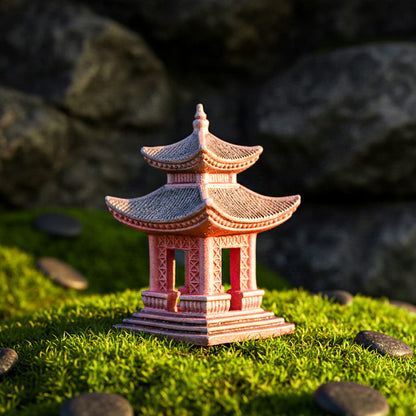 Close-up of a handcrafted ceramic pagoda with intricate pillar details and a weathered grey roof. The reddish-brown clay figurine rests on a mossy surface, designed as non-toxic ceramic aquarium decor or a bonsai accent.