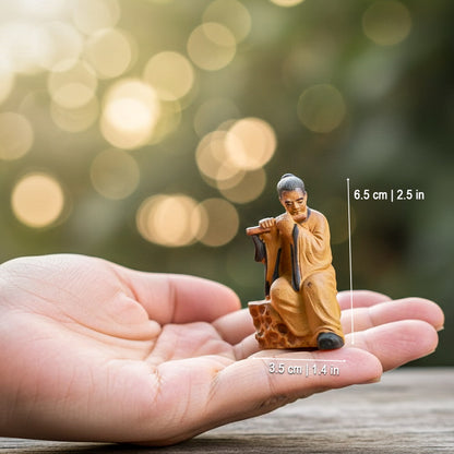 Classic Flute Player Mudmen Figurine Ceramic Sitting Pose