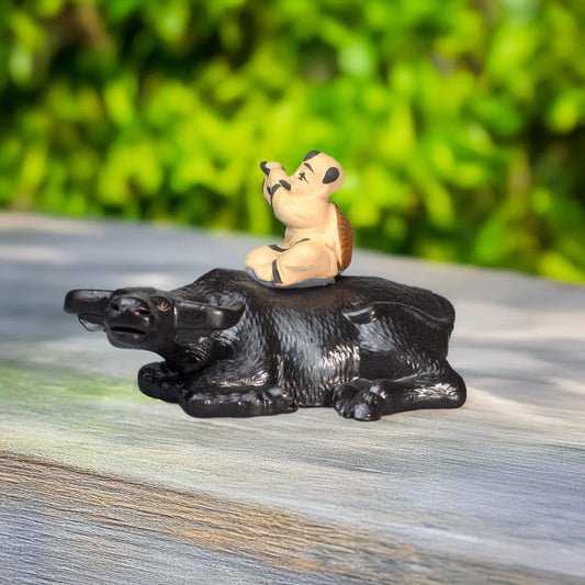 Handcrafted Ceramic Flute Boy on Resting Buffalo Statue