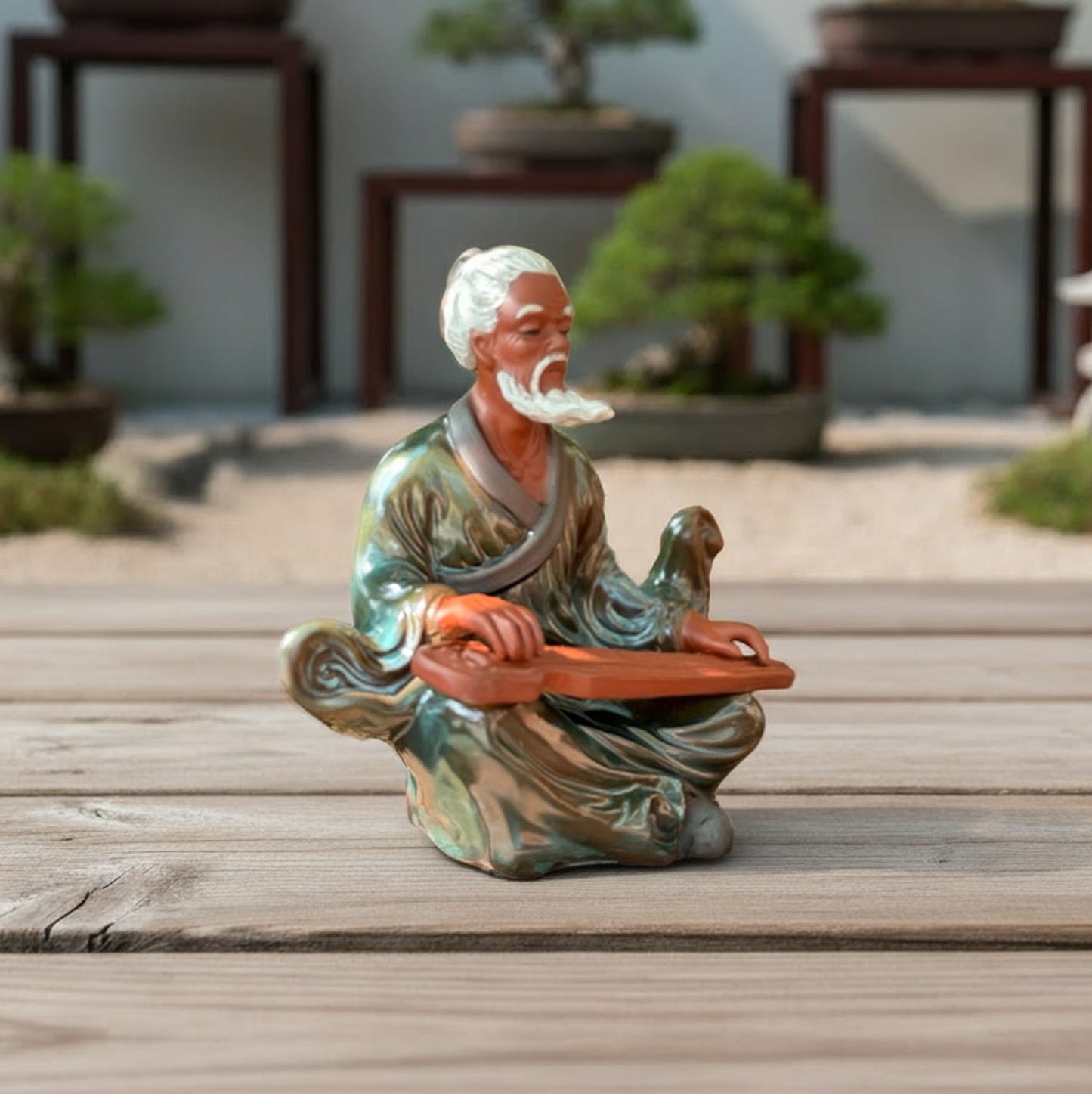 A front view of a green glazed miniature bonsai figurine, great for bonsai decor.