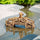 Brown wood-textured miniature bridge for garden over water; a fairy bridge reflecting. 