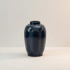 A studio shot of the blue ceramic vase. A beautiful example of a handmade vietnamese vase.
