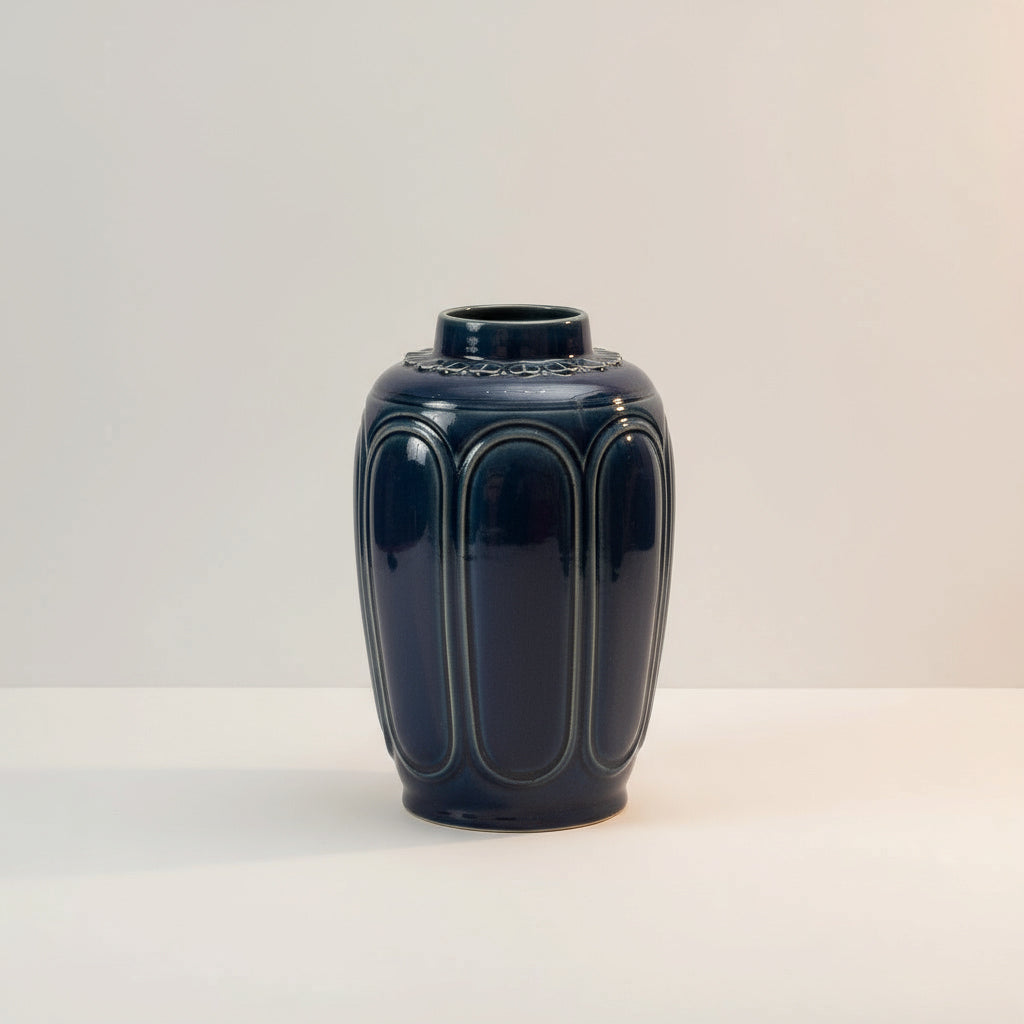 A studio shot of the blue ceramic vase. A beautiful example of a handmade vietnamese vase.