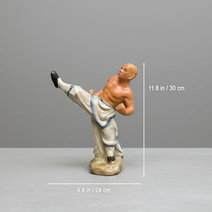 A kicking monk ceramic figurine shown with dimensions. A great miniature bonsai figurine.