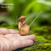  A Patient Angler, a small mudmen figurine on a finger. A great piece of bonsai decor.