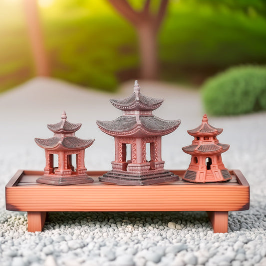 Three reddish-brown handcrafted pagoda statues as bonsai figurines. Ideal for Zen garden decor.