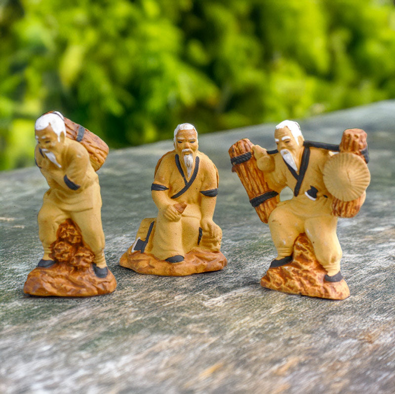 This set of three miniature woodcutters, each in a different pose, brings a touch of life and movement to any bonsai display, capturing the essence of rural Vietnam.