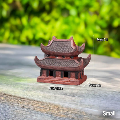  Small size Vietnam pagoda statue. A reddish-brown ceramic pagoda shown for scale on wood.