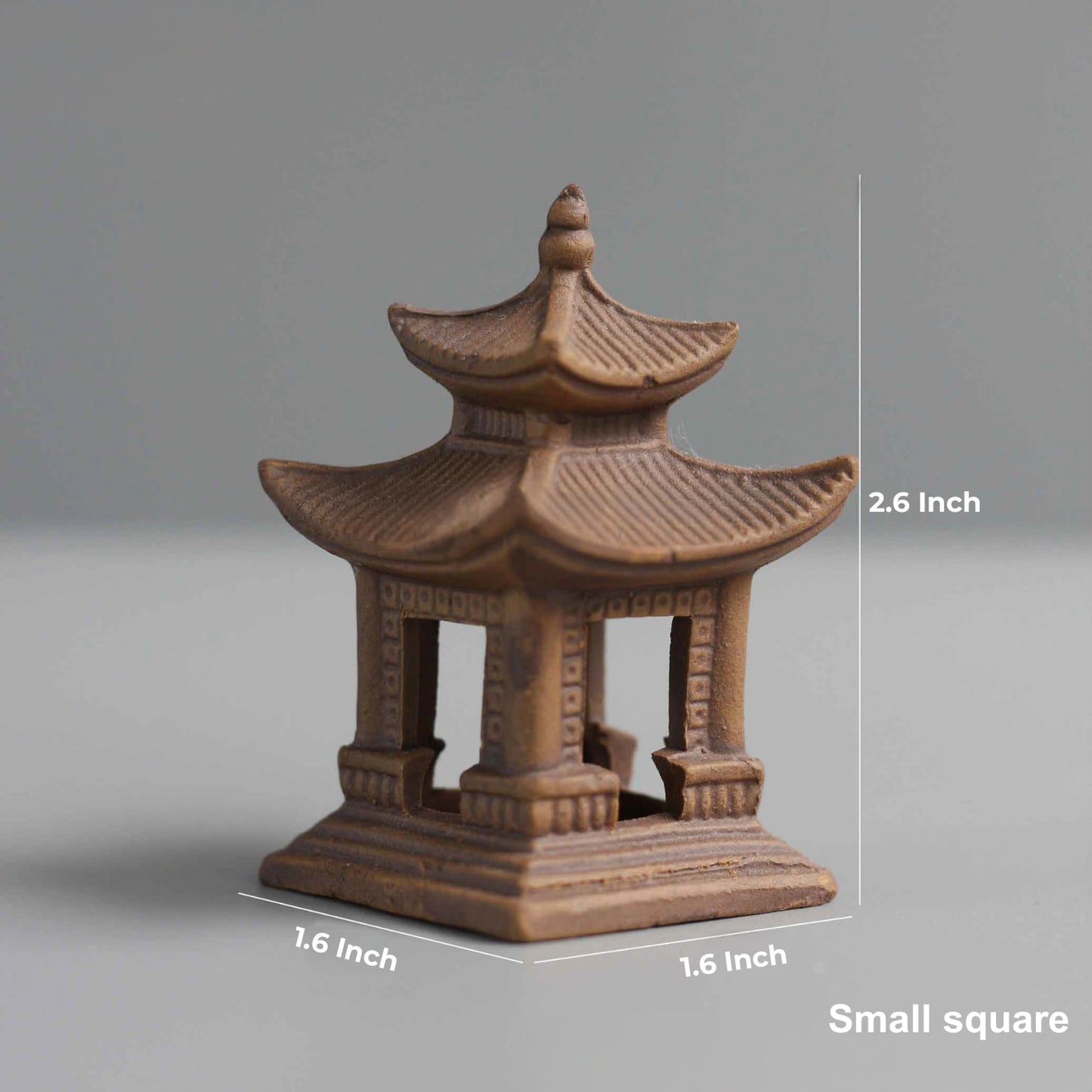 The small square miniature pagoda figurine with its dimensions marked: 2.6 inches in height and 1.6 inches at the base.