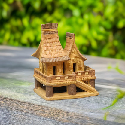 This unique miniature stilt house, with its intricate details and warm brown ceramic, adds a touch of Southeast Asian authenticity to any bonsai arrangement.