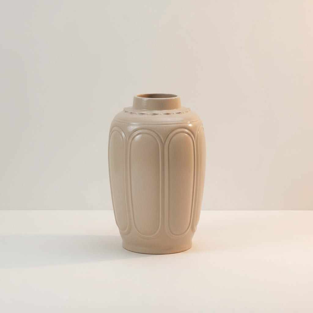 A studio shot of the Vietnamese ceramic vase. This is a simple and elegant ash glaze vase.