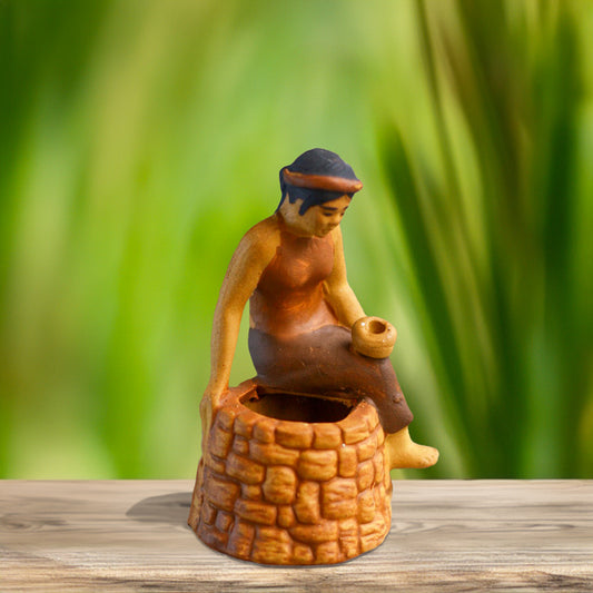 A young Vietnamese woman, dressed in traditional brown attire, sits gracefully on the edge of a miniature ceramic well, evoking a sense of timeless folklore.