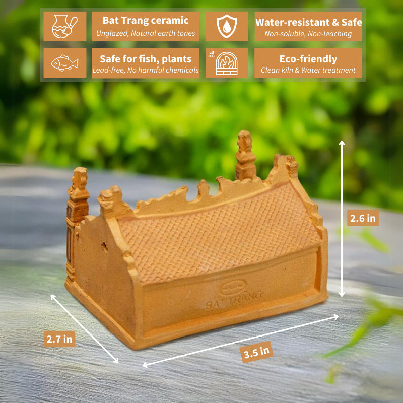 The curved tile roof of a miniature Vietnamese communal house, crafted from traditional Bat Trang ceramic, showcases the intricate craftsmanship and rustic beauty of this unique art form.